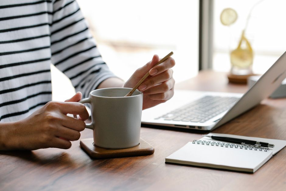 home desk or kitchen table before work starts coffee mug notebook task list lifestyle photo 2