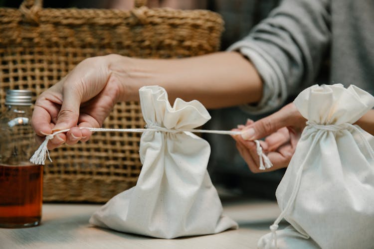 Tying A White Cloth Bag