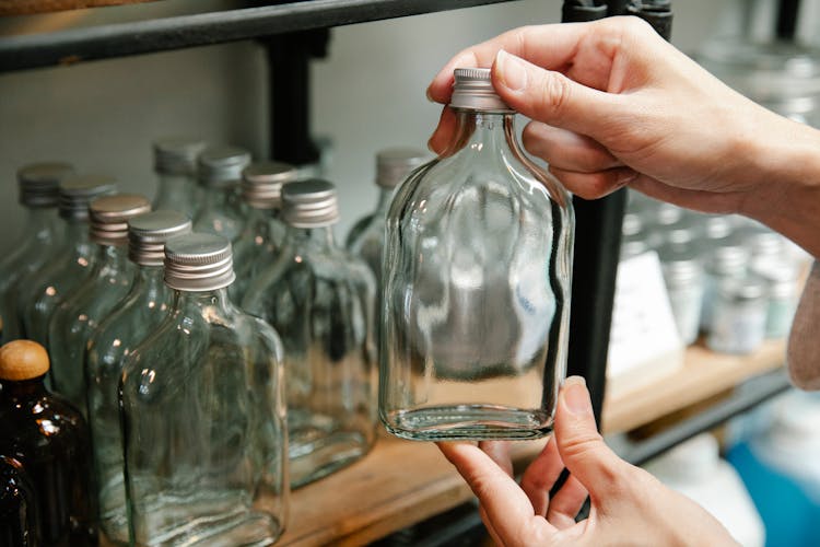 Clear Glass Bottles On A Shelf