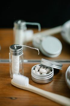 Discover eco-friendly oral hygiene tools on a rustic wooden surface, highlighting sustainability.