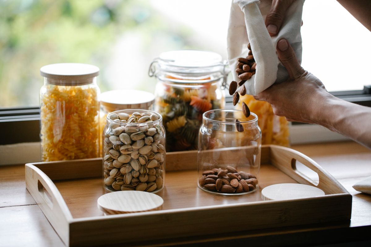 Filling a glass jar from bulk supplies for spice storage ideas
