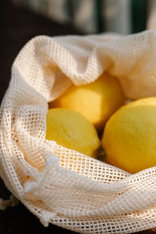 Pile of lemons in mesh bag