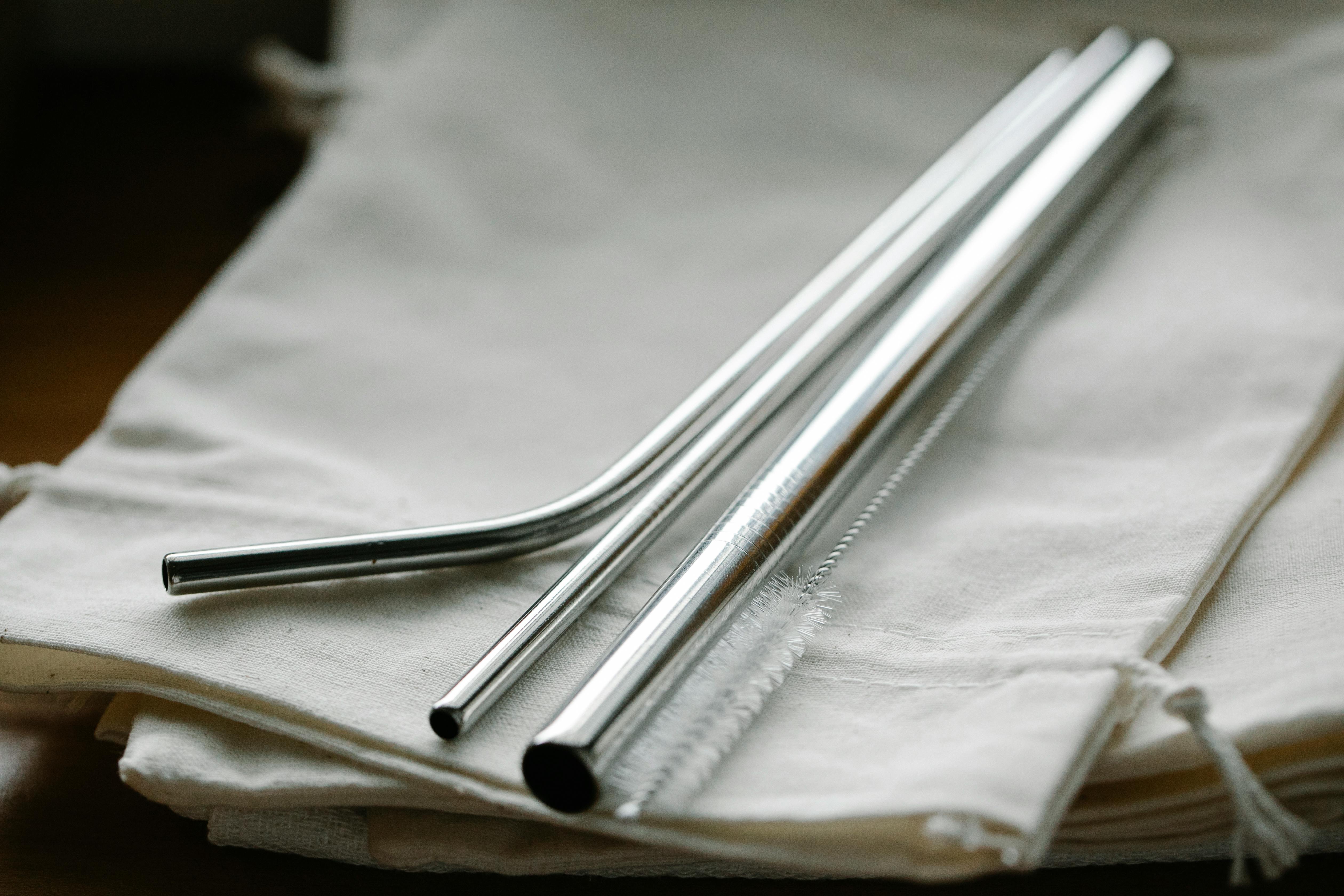 set of steel straws and brush on reusable bags