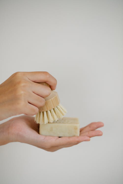 Free Woman with brush and soap in hands Stock Photo
