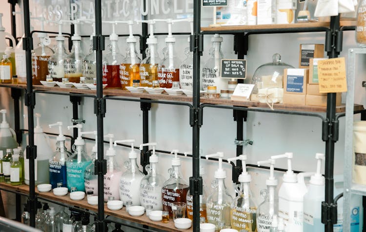 Soap In Many Plastic Bottles On Shelves