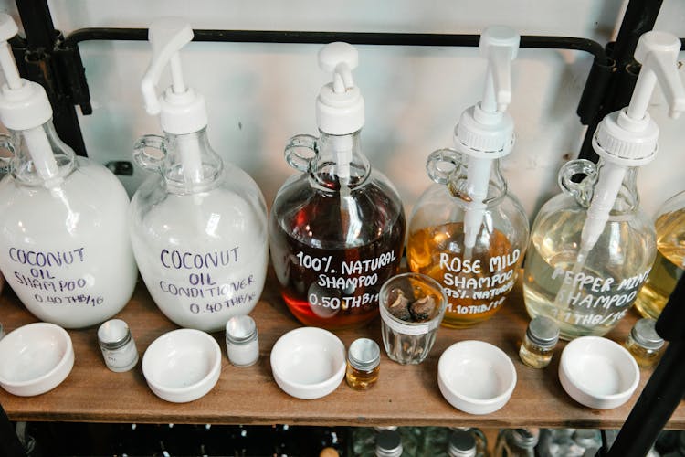 Big Dispensers Of Shampoo On Shelf