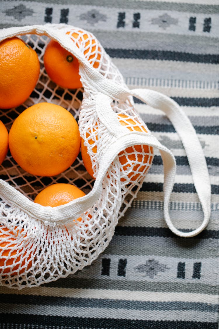 Fresh Orange Tangerines In Wicker Bag