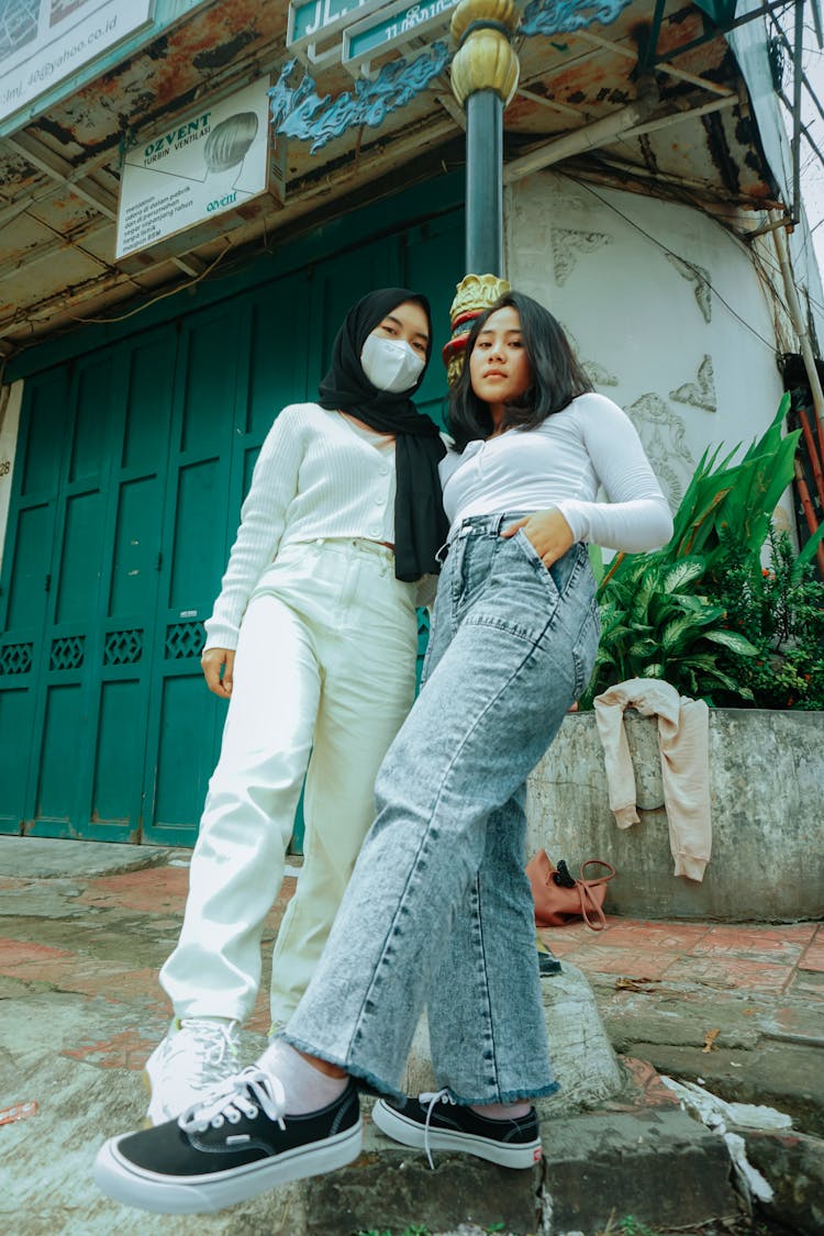 Asian Female Friends Standing Together Outside