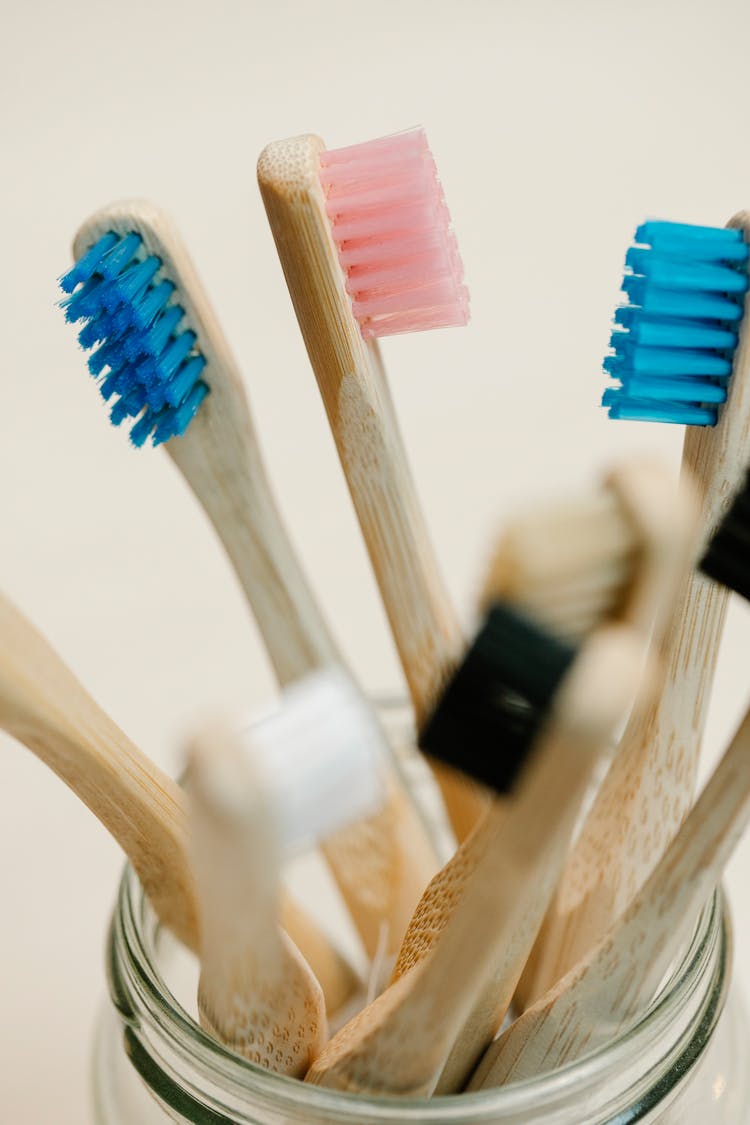 Wooden Colorful Toothbrushes In Glass Jar