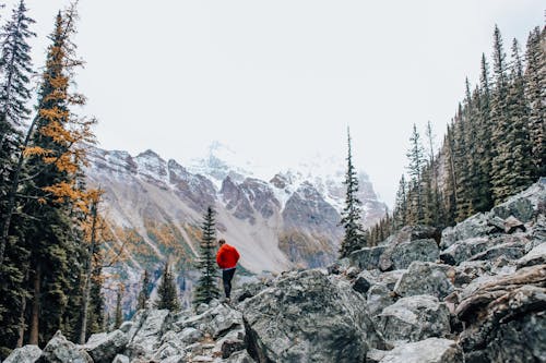 Man Walking on Rocky Mountainside