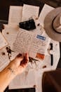 Person Holding White Printer Paper