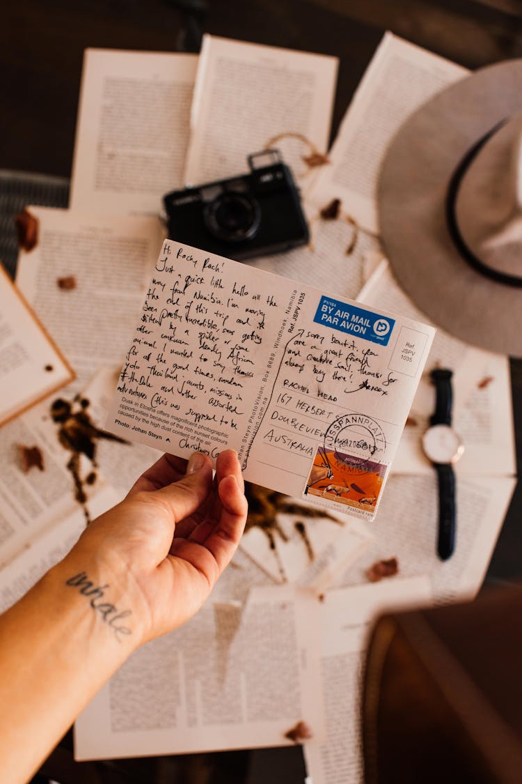 A Person Holding A Letter