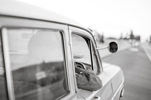 Free Grayscale Photo of a Car on the Road  Stock Photo