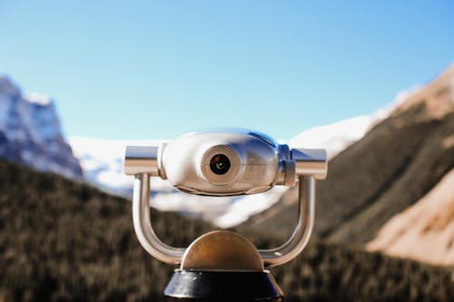 Free Close-up of Binoculars on Mountain Landscape Stock Photo