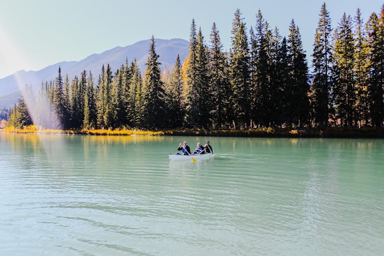 People Riding On A Kayak Boat 