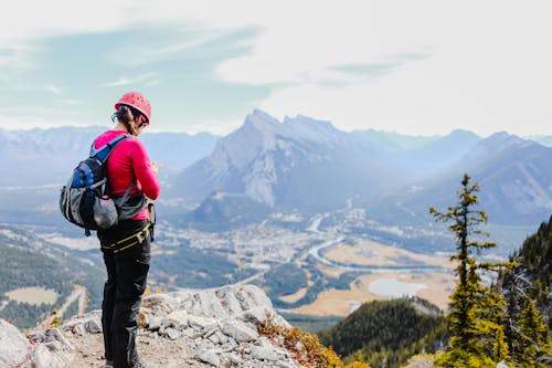 Woman Wearing Sweater Standing on Mountain top