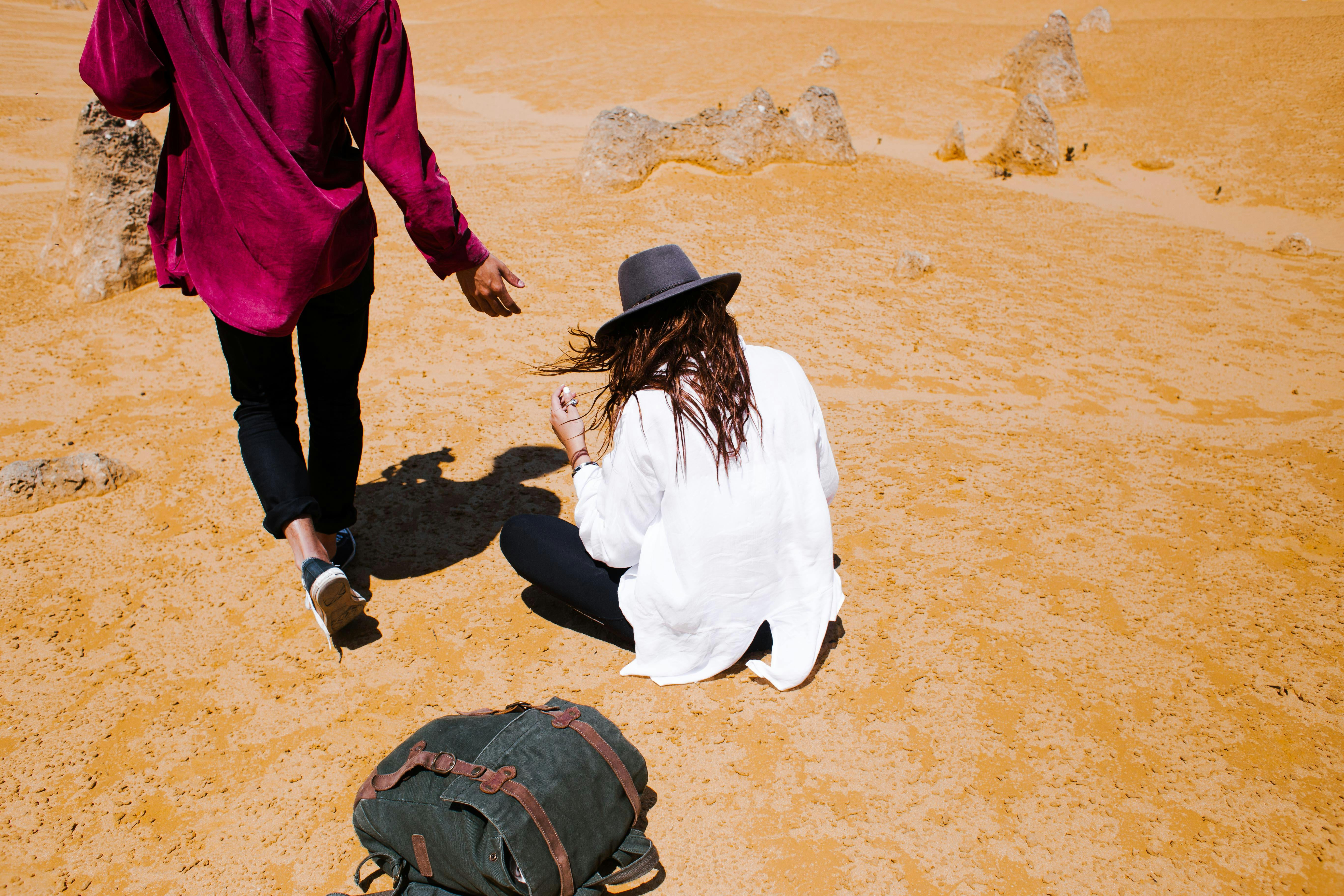 people in sand arid desert