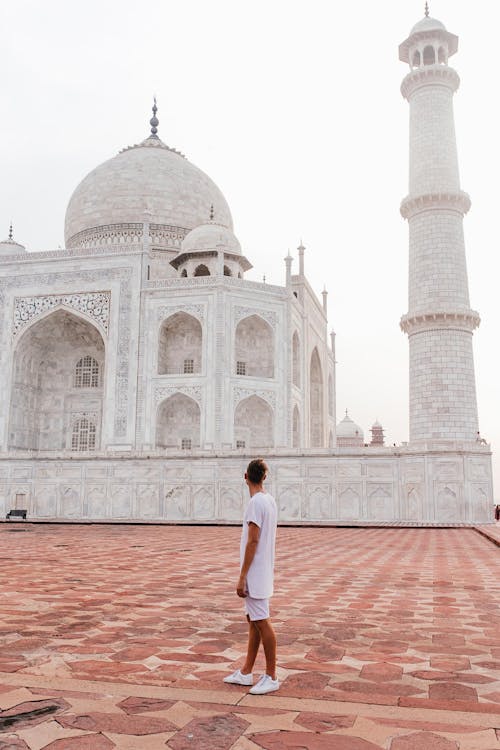Free A Man Standing Near to Taj Mahal Stock Photo