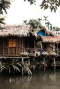 Brown Wooden House on Body of Water