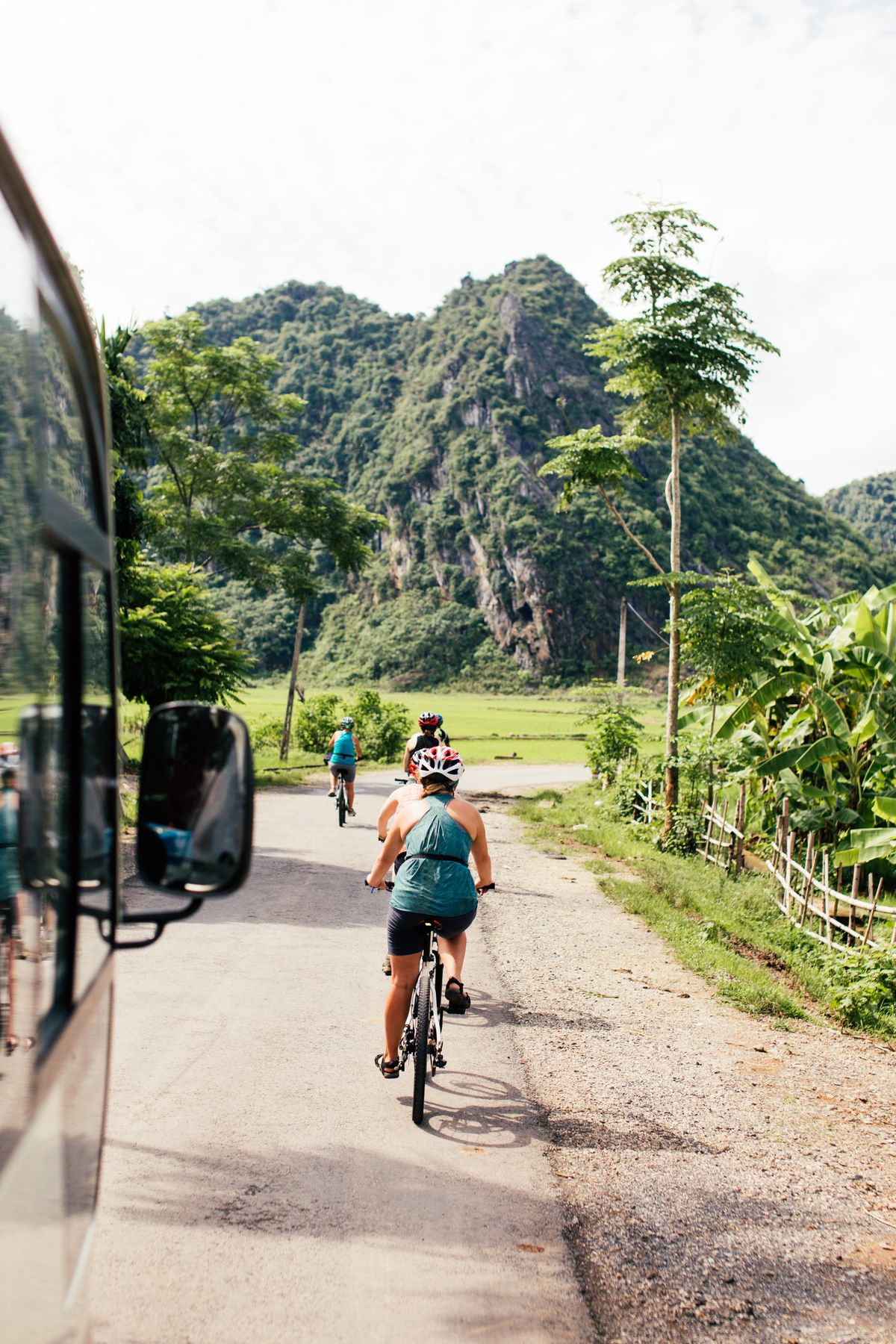 Cyclists traveling along a scenic mountain road