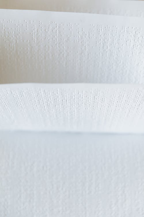 Free Close-Up Shot of White Braille Paper Stock Photo