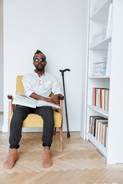 A Blind Man using a Braille Book