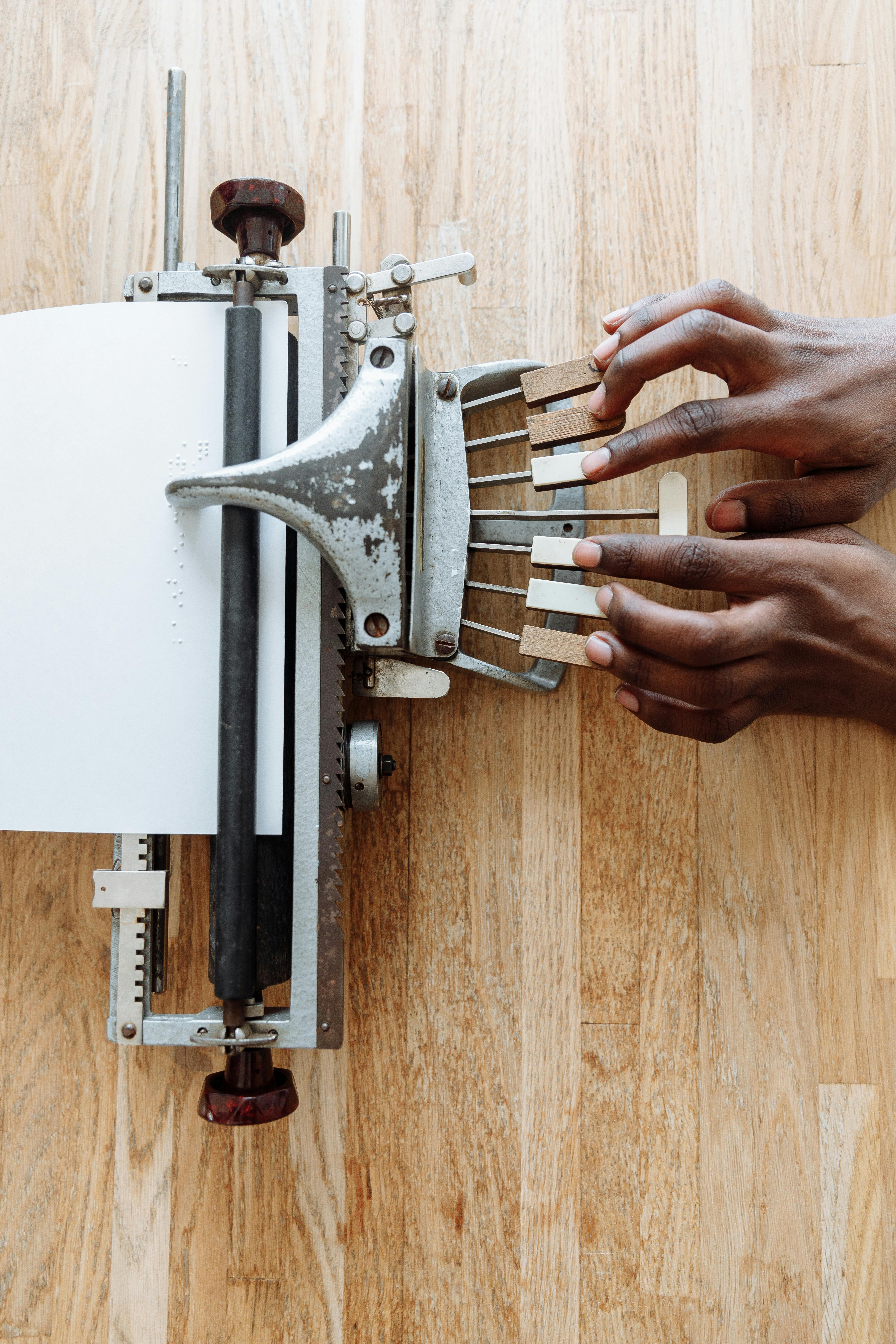 person holding gray and white machine