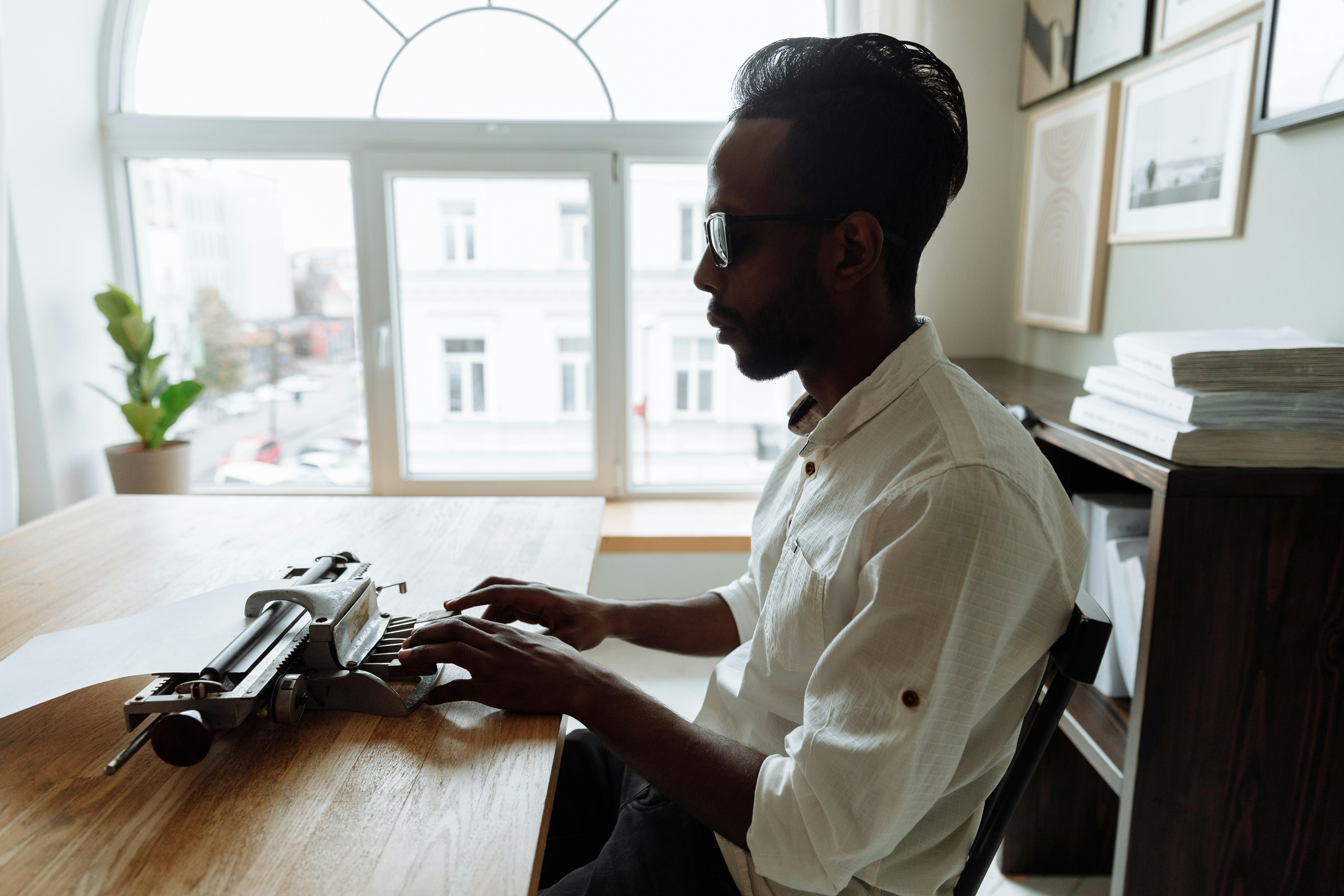 A Man Sitting at the Table · Free Stock Photo