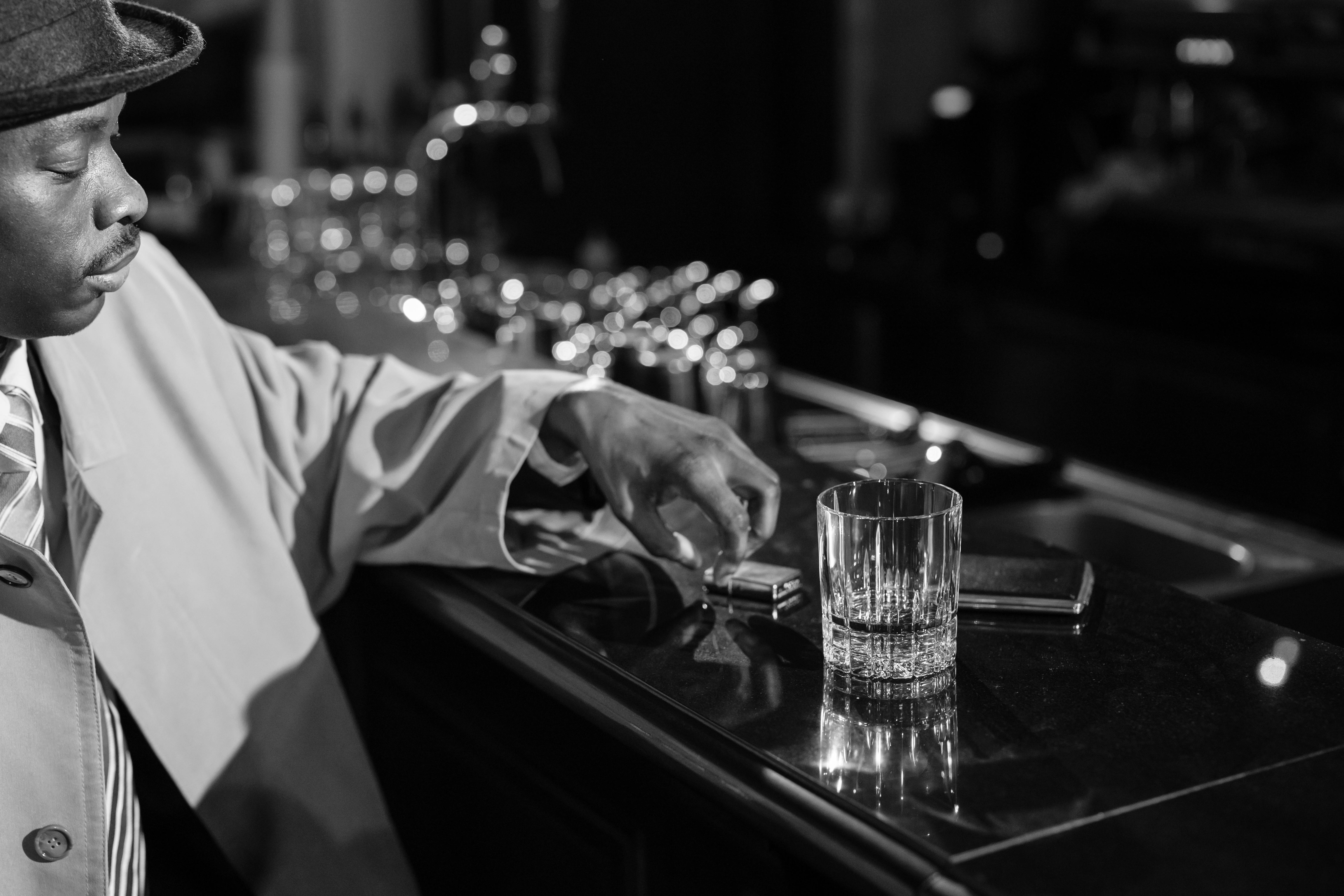 photo of man holding silver lighter