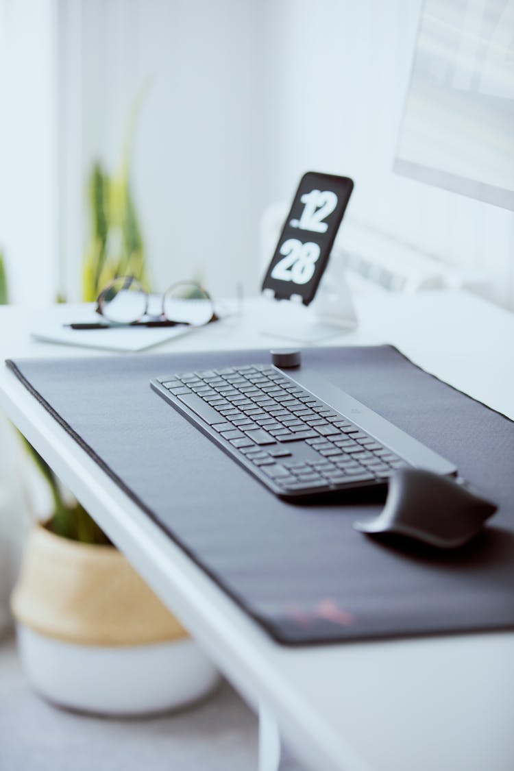 A Mouse And A Keyboard On A Mouse Pad