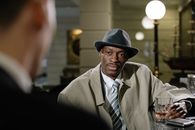 Photo of Man Wearing Beige Trench Coat