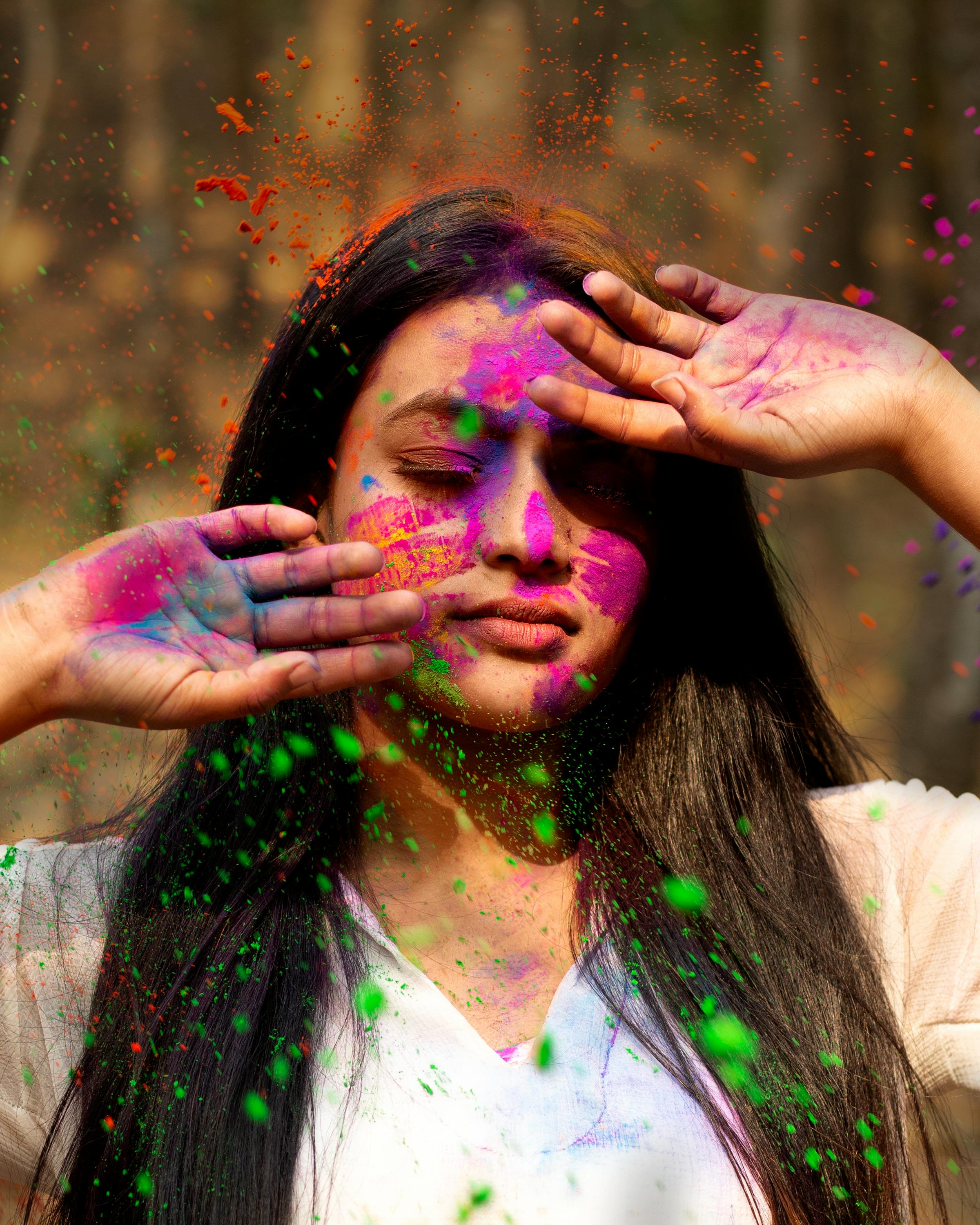 Woman Splashing Hair With Holi Powder High-Res Stock Photo - Getty Images