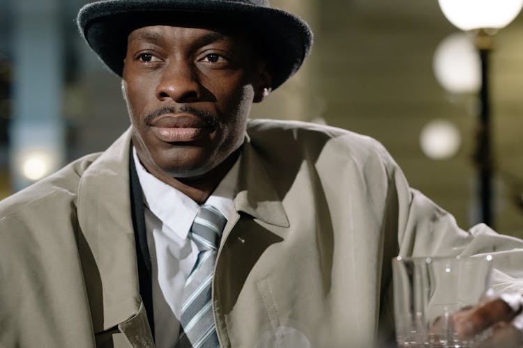 Close-Up Photo Of Man Wearing Black Fedora Hat