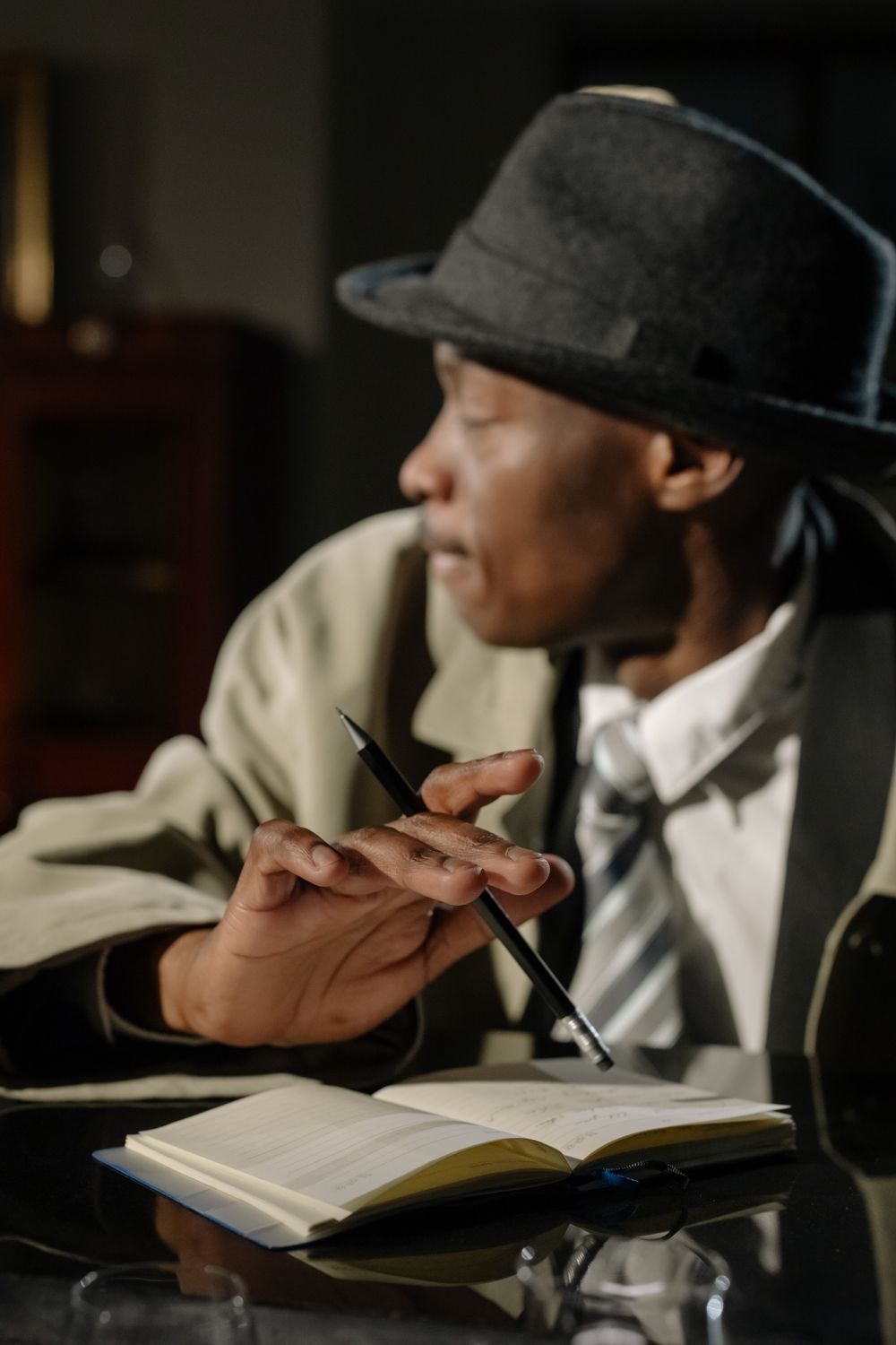 Investigator writing details into a notebook