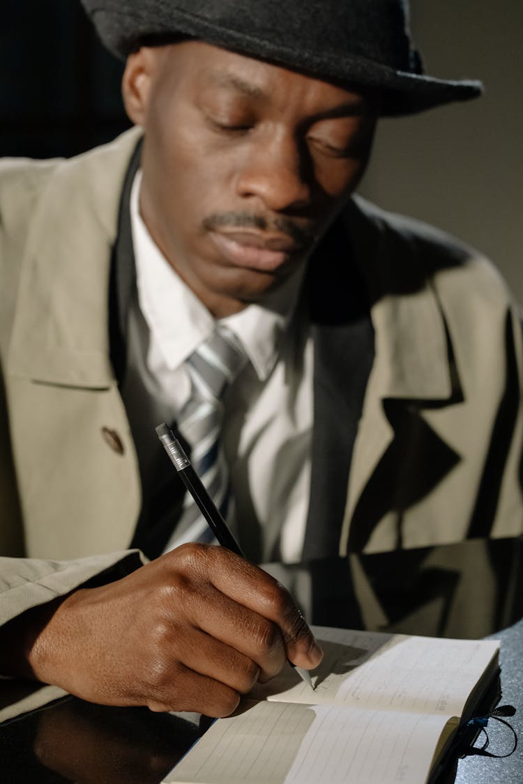 Photo Of Man Taking Down Notes