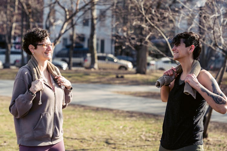 Sporty Athletic Women Smiling And Resting After Sport In Yard