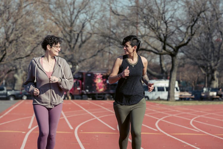 Young Fit Women Jogging On Stadium