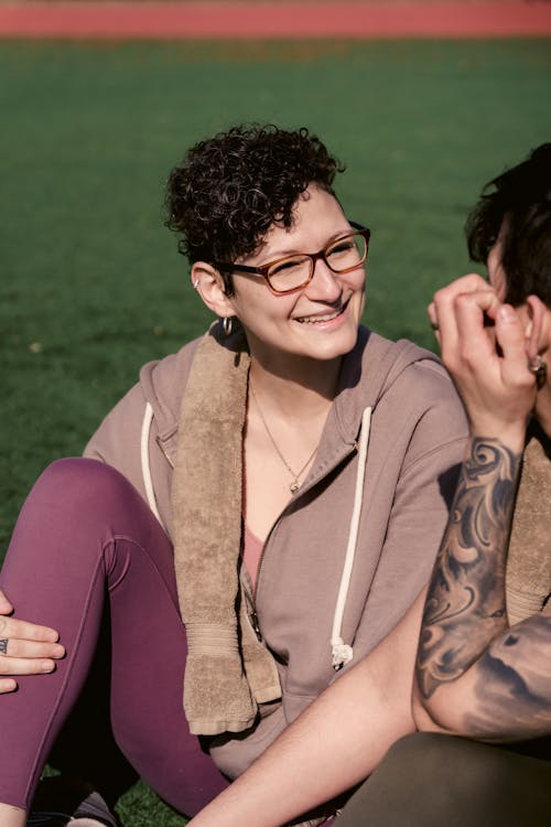 Free Happy woman talking with unrecognizable friend Stock Photo