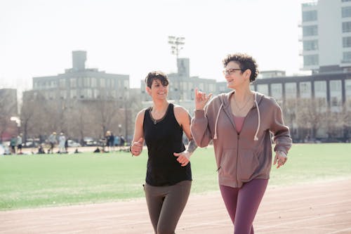 Free Two sportswomen jogging in morning Stock Photo