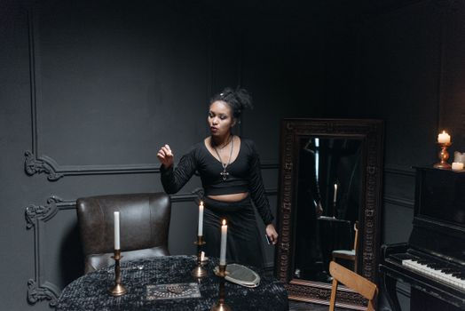 A Woman in Black Long Sleeve Crop Top Standing at the Table