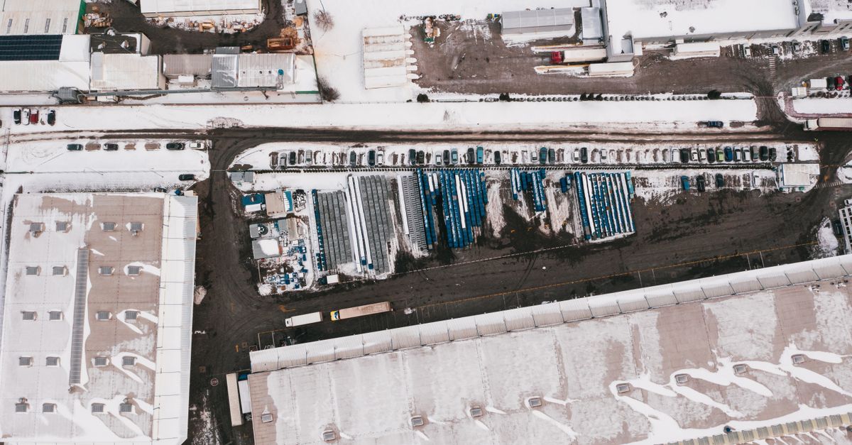 Aerial photograph of a snow-covered industrial facility in Poland during winter.