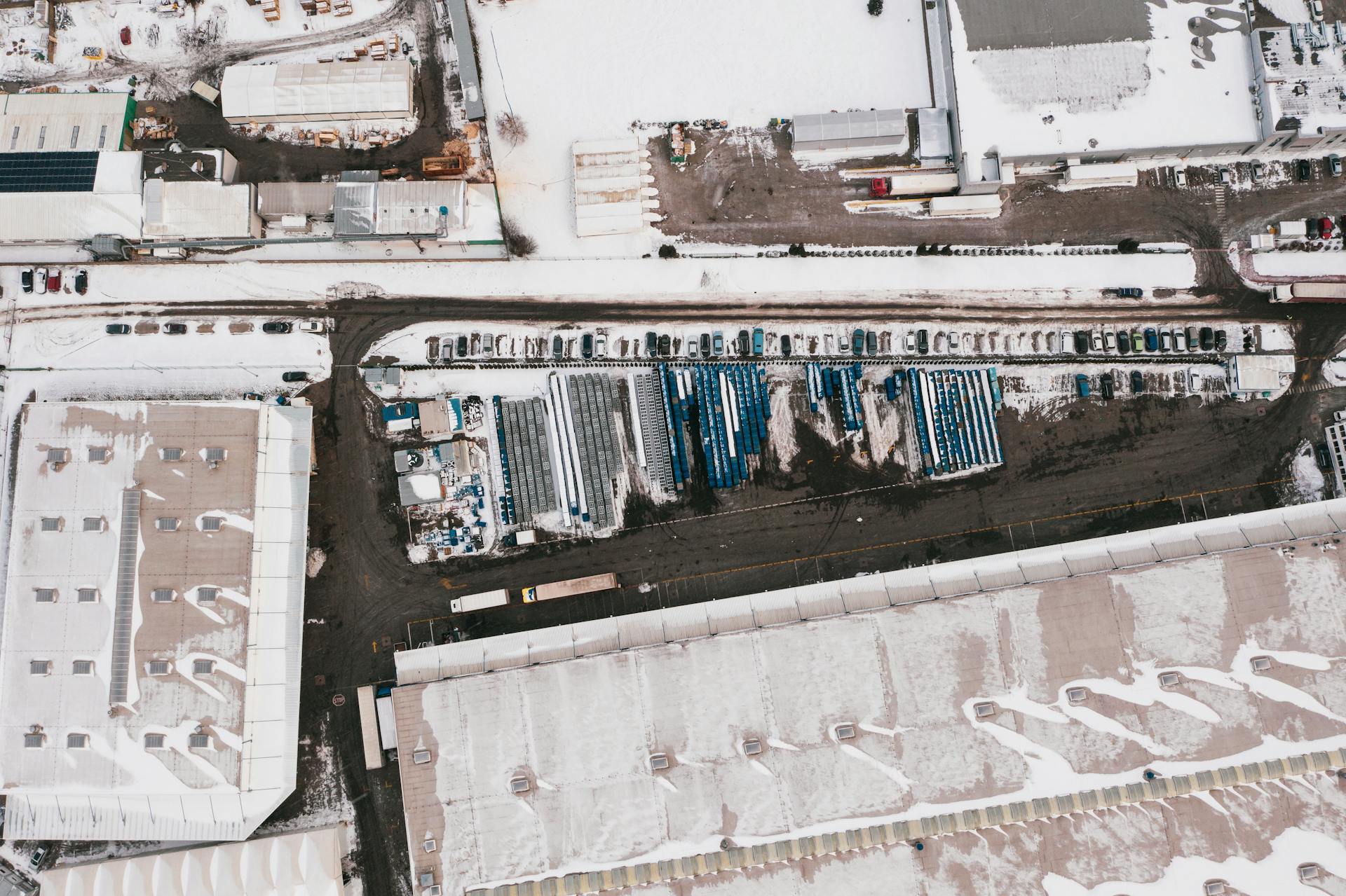 Aerial photograph of a snow-covered industrial facility in Poland during winter.