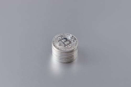Free Silver Coins on White Surface Stock Photo