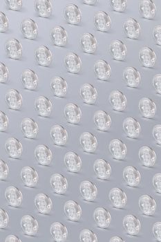 Rows of silver bitcoins arranged symmetrically on a light background, highlighting digital currency themes.