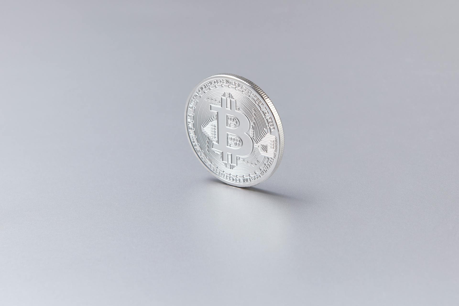 Silver Coin on White Surface