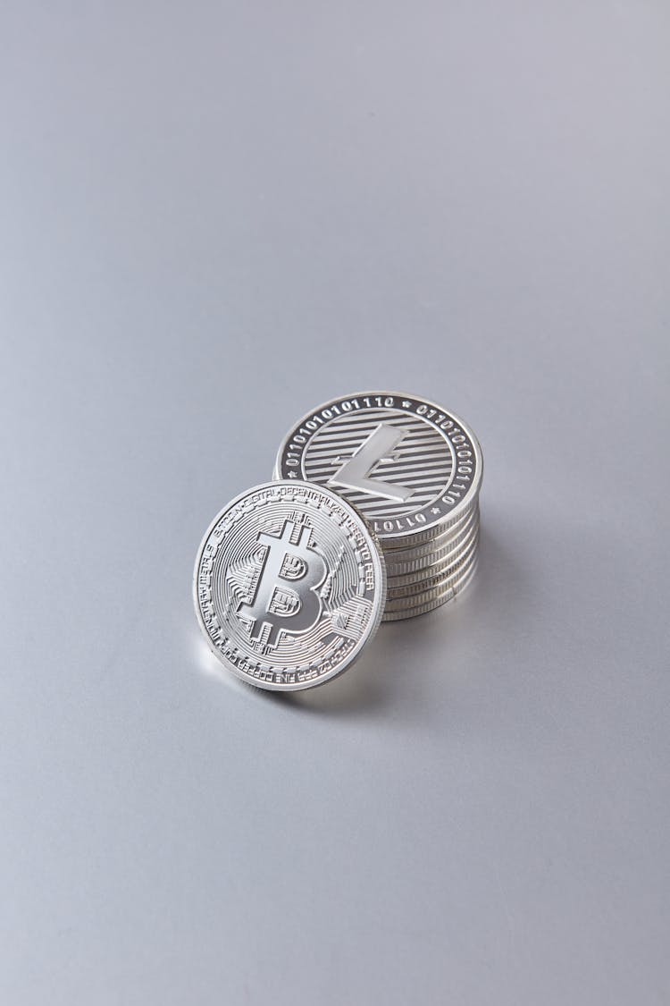 Stacked Up Coins On White Surface