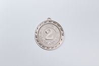 Silver Round Coin on White Surface