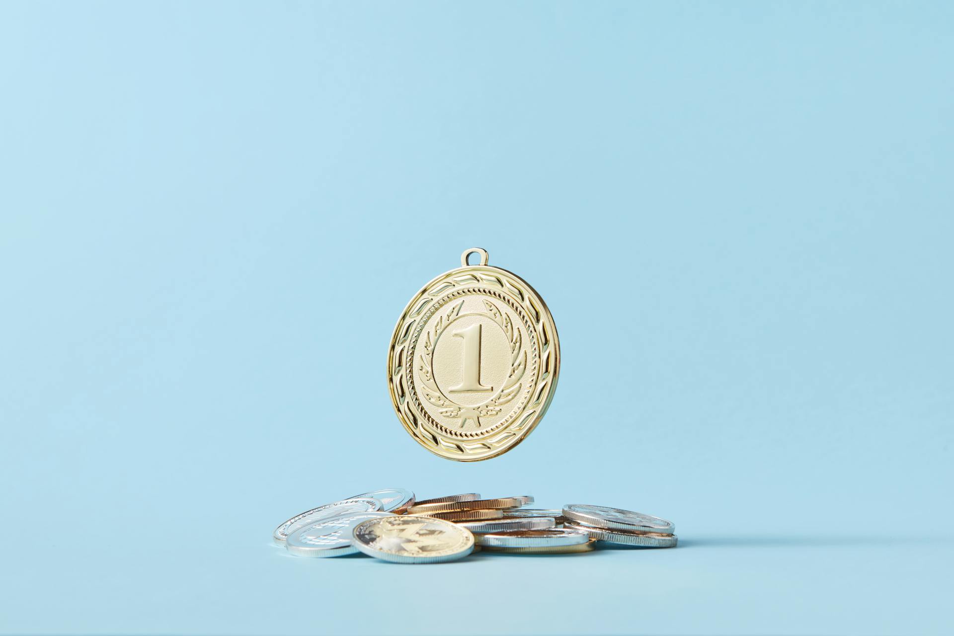 A Round Number Pendant on a Pile of Coins