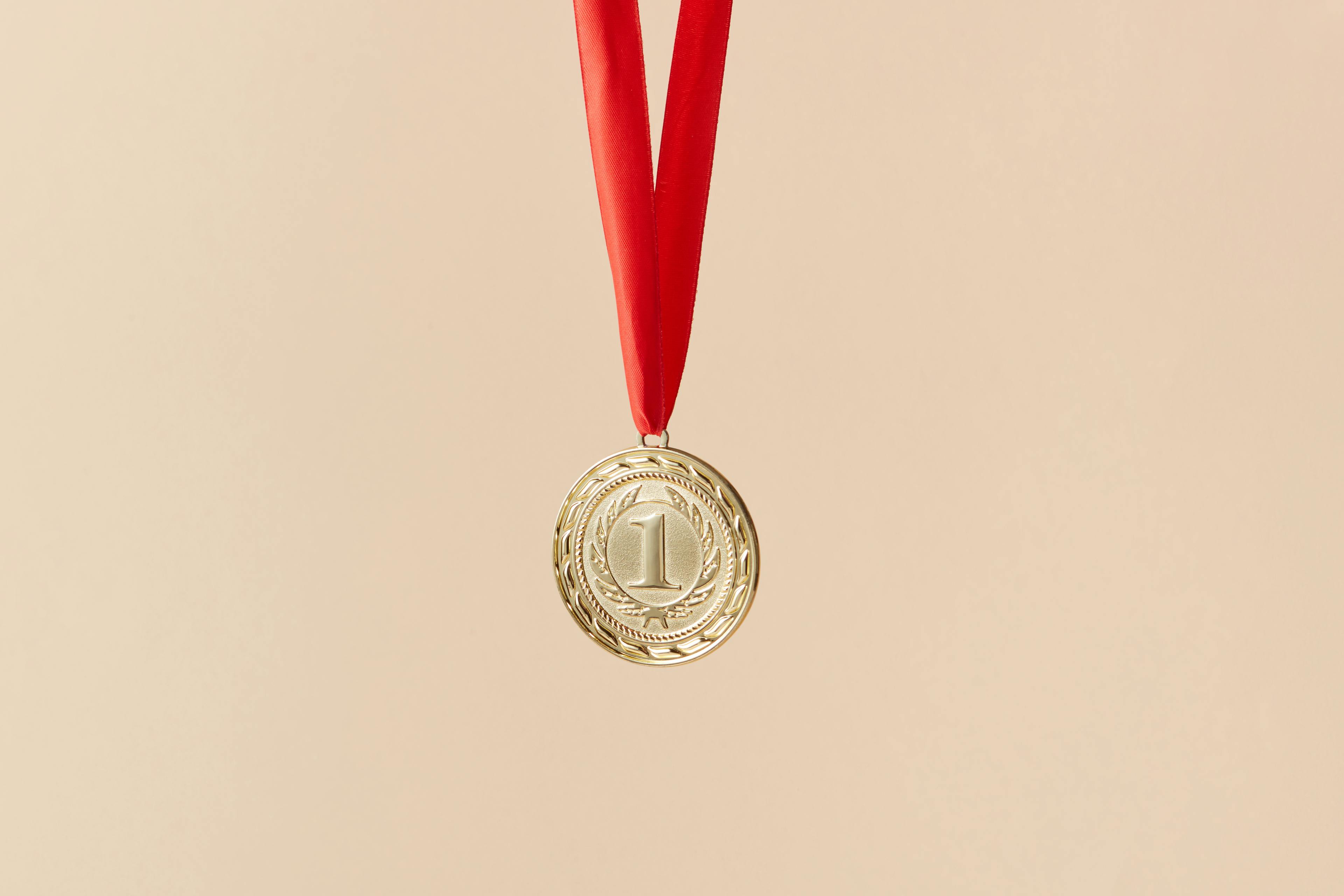 Gold Round Ornament on Red Lace