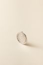 Silver Round Coin on White Surface
